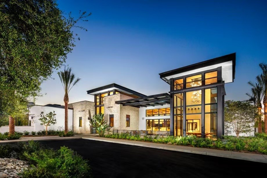 Modern clubhouse exterior at sunset